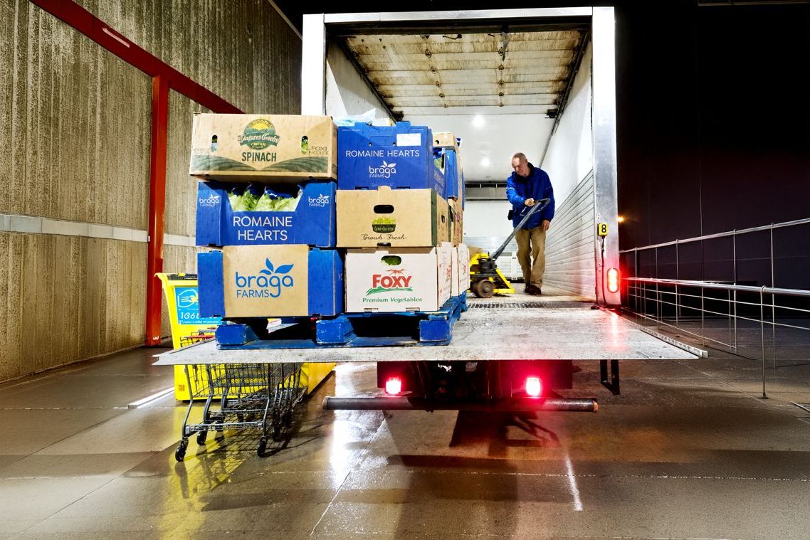 A Harvest Hands truck being unloaded at the loading dock